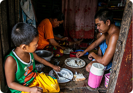 Family sharing food in Mozambique